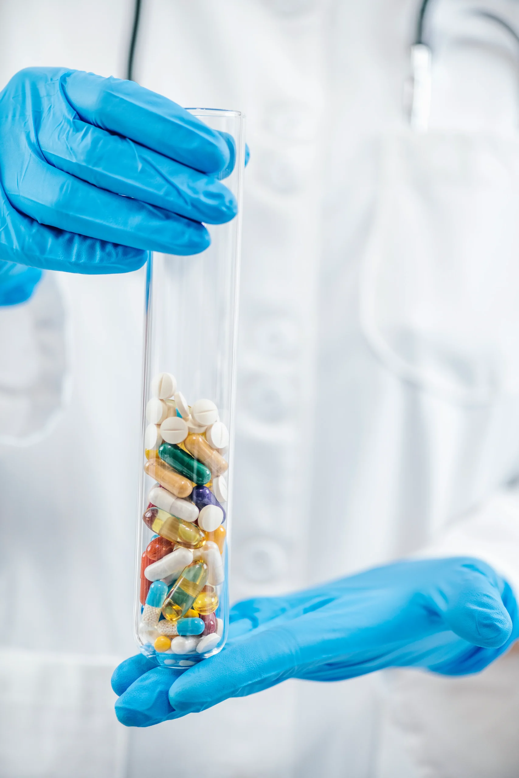 Drug database and clinical drug database concept with capsules in a test tube.