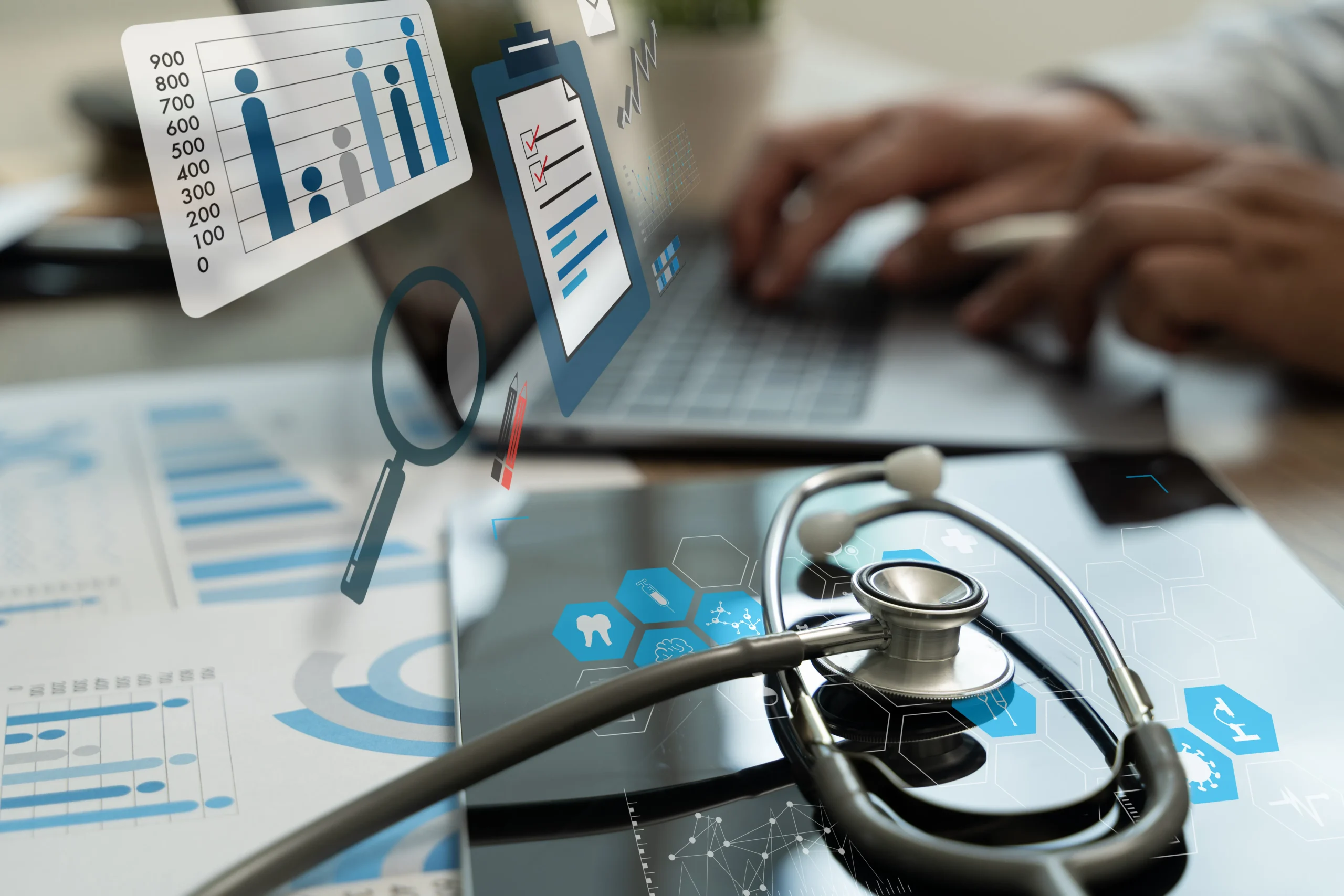 A healthcare professional tracking medical records on a computer to optimize EMR drug data and ensure healthcare interoperability.