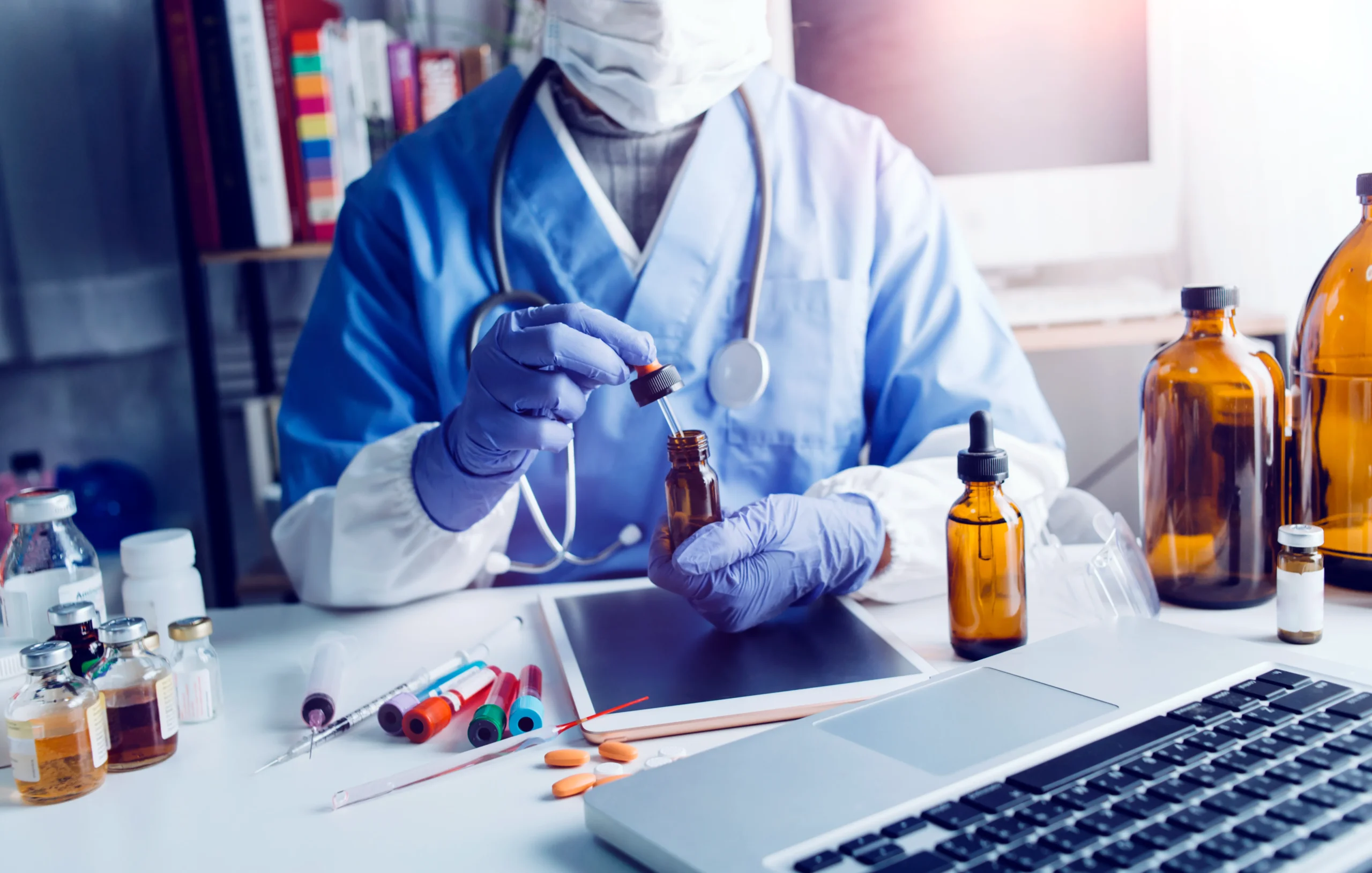 A healthcare professional preparing medication at a desk, comparing a drug database versus a drug database API.