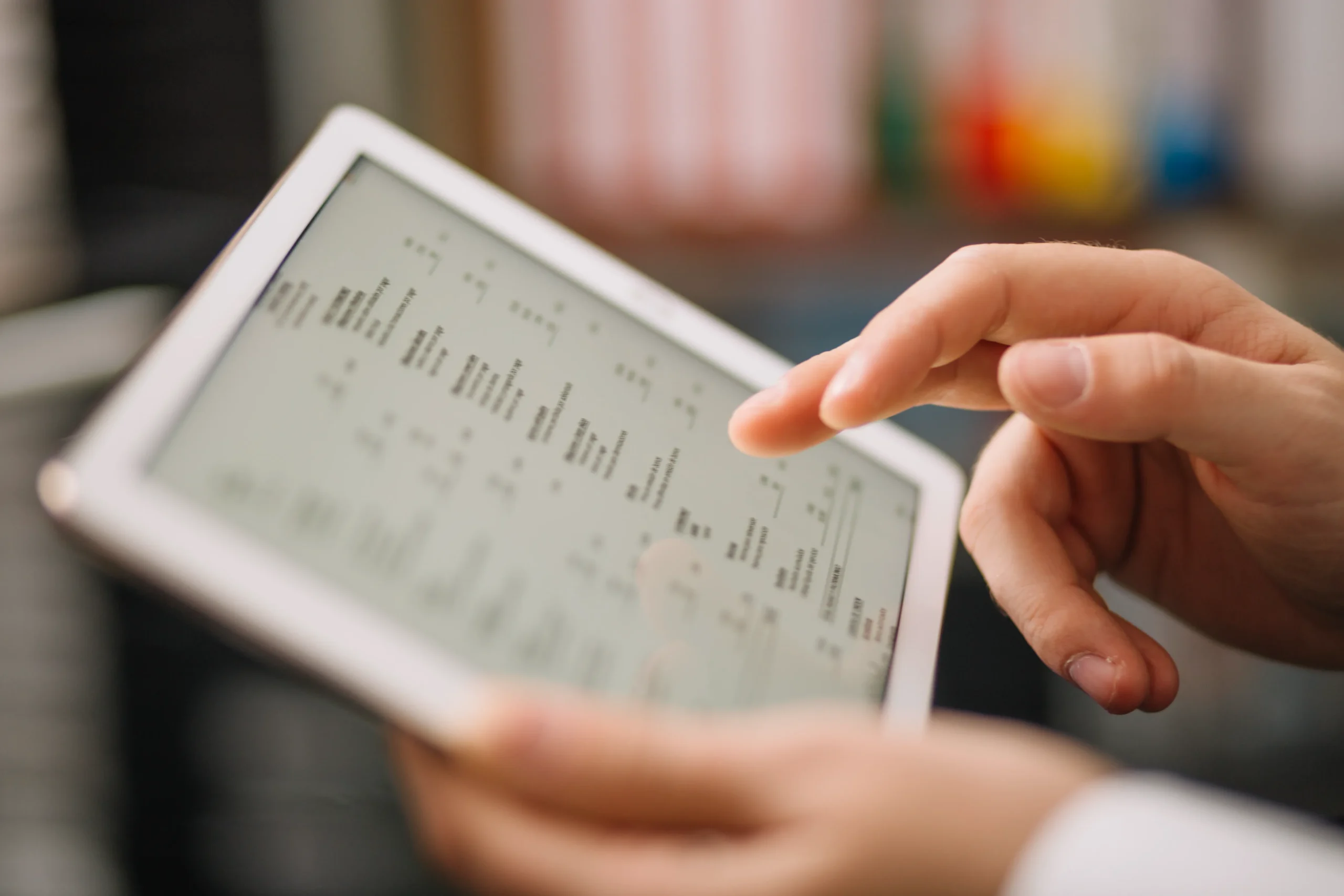 User scrolling through structured pharmaceutical records on a tablet using a drug database API.