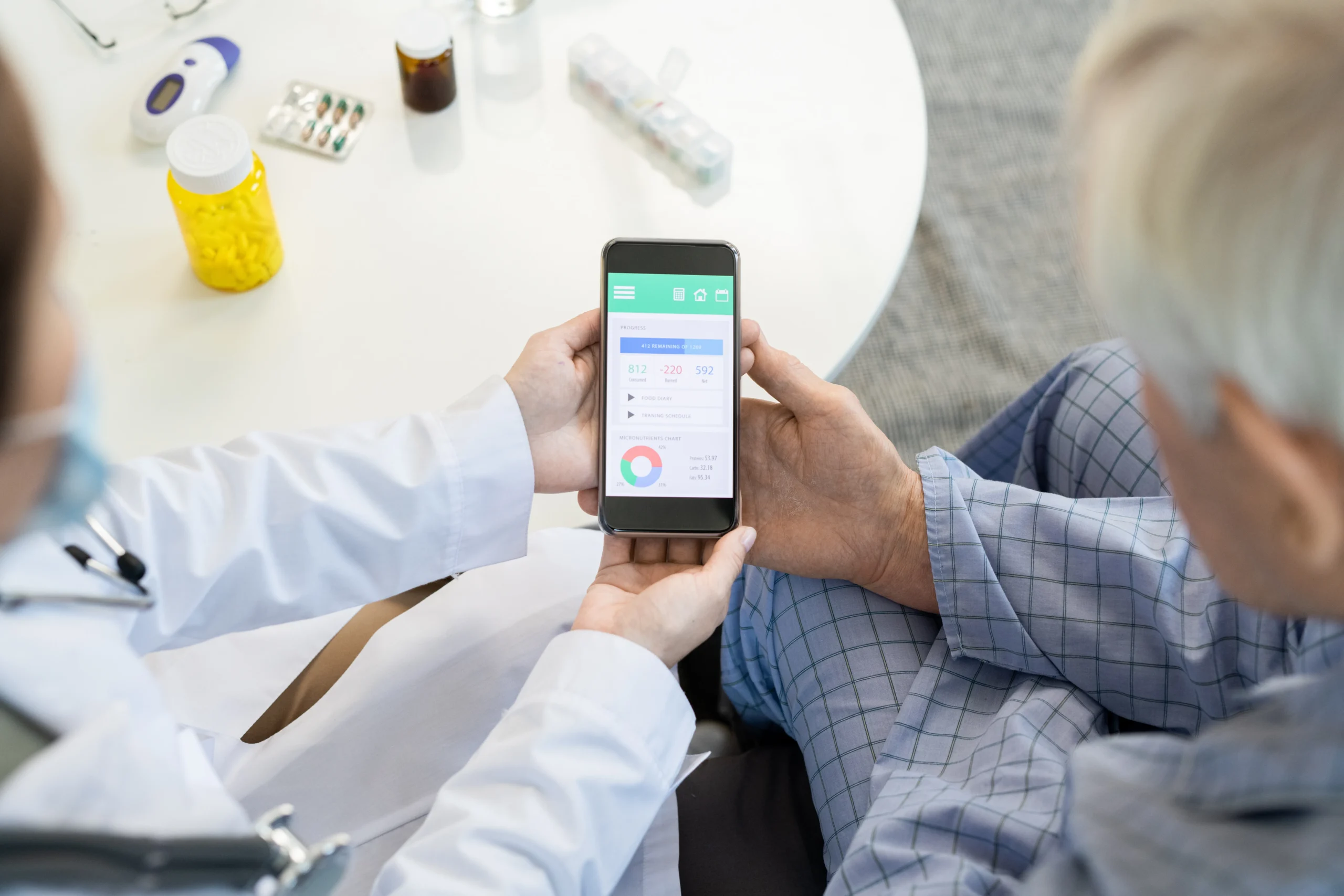 Doctor explaining mobile dosage schedules and patient health metrics powered by an integrated Medication API.